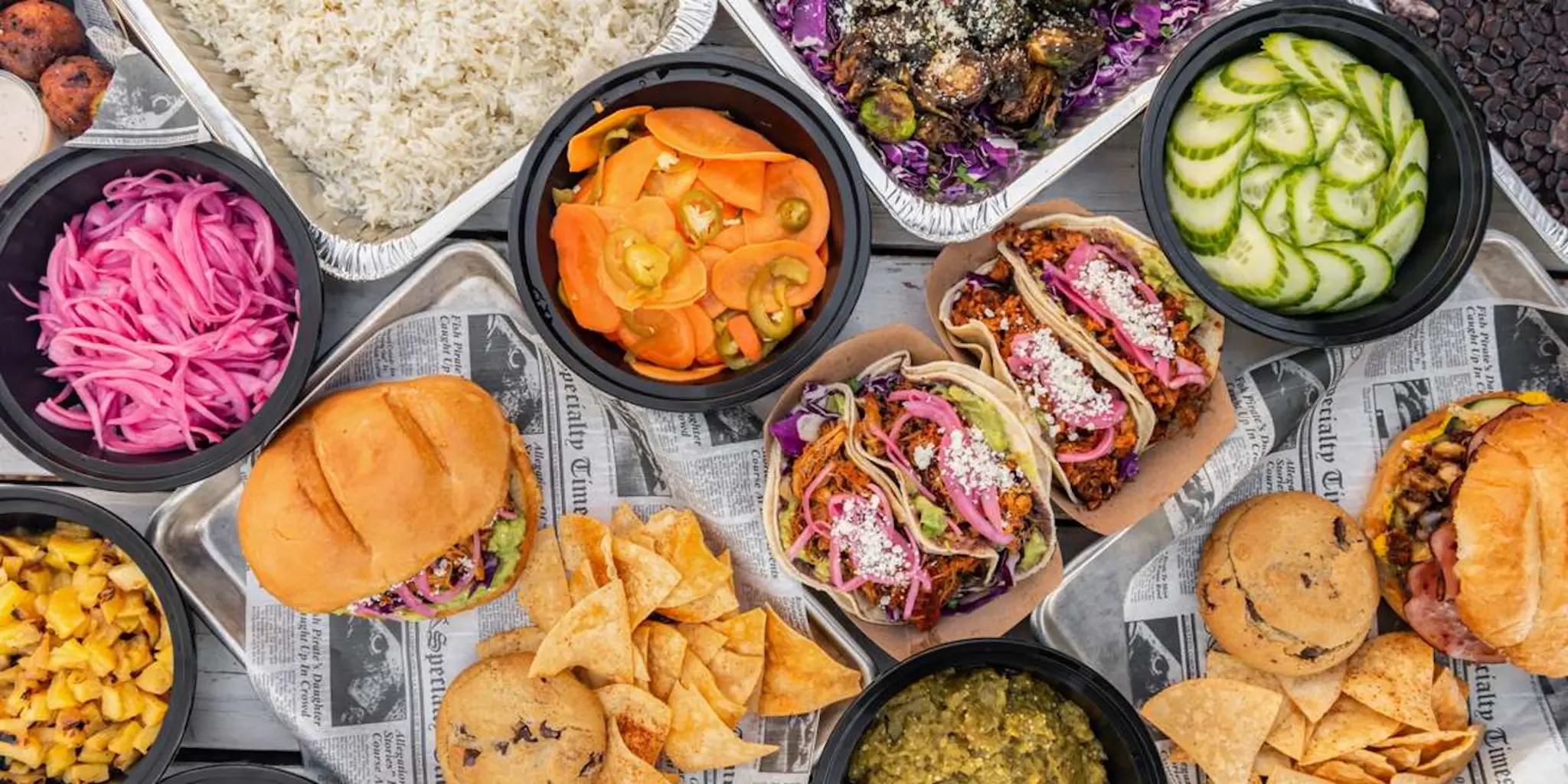 Austin Daily Press catering spread — tortas, bowls, taco bar for Austin offices